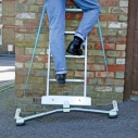 Anchor-Fix widens the ladder's base and helps stability on sloping ground